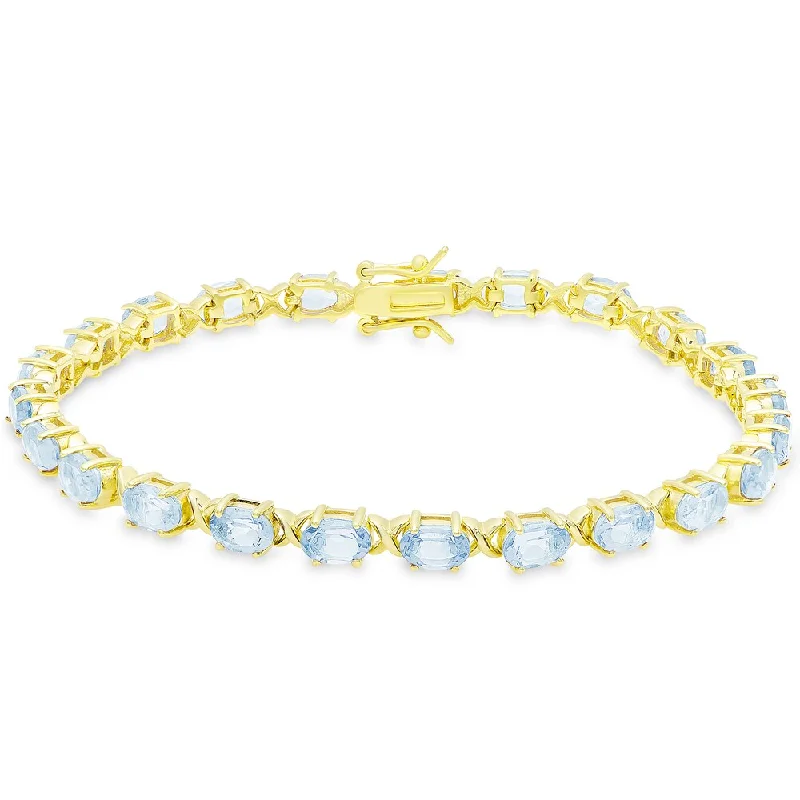 Glossy link bangles-Dolce Giavonna Gold Over Sterling Silver Oval Cut Blue Topaz XO Link Bracelet