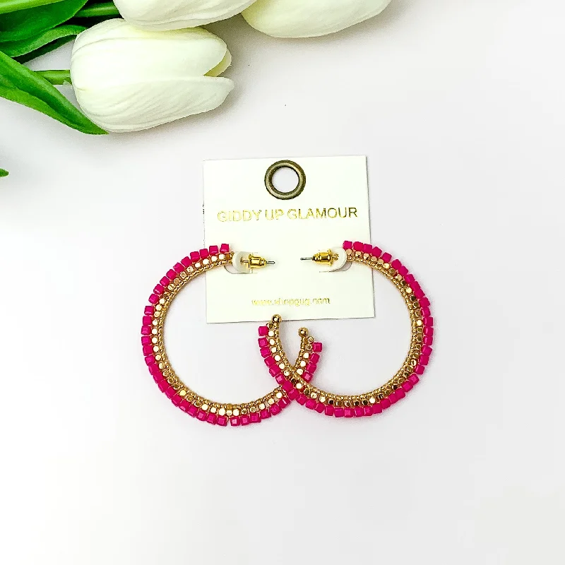 Braided cord earrings-Gold Tone Beaded Hoop Earrings with a Hot Pink Crystal Outline