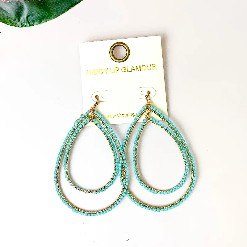 Trekker feather earrings-Double Open Teardrop Gold Tone Earrings with Beaded Outline in Turquoise Blue